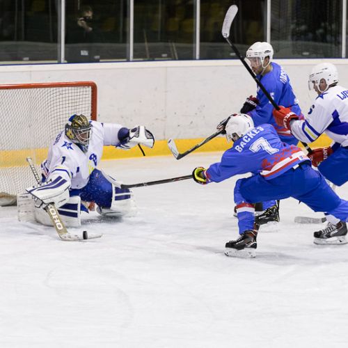 ice hockey player fighting for the puck